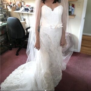 Used wedding dress. Strapless heart shape neckline with hourglass shaping.